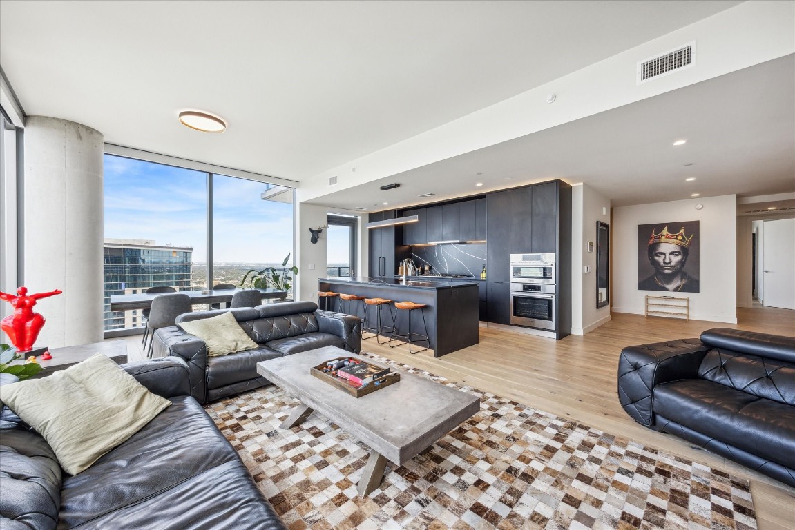 44 East Avenue, Unit 4203 Austin, TX 78701 - Photo 10 of 26 a living room with furniture and a rug