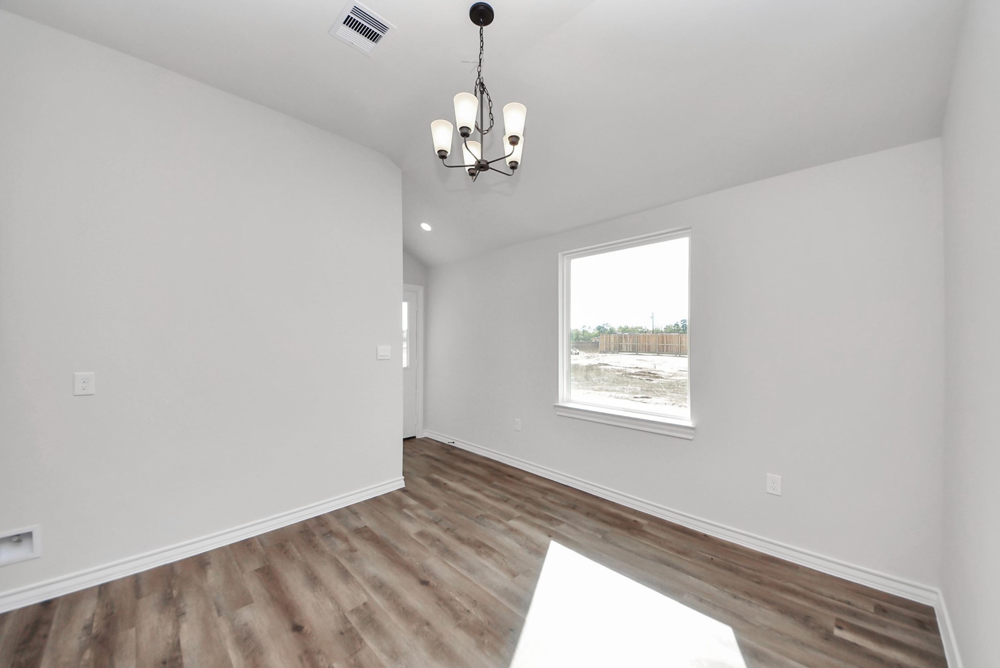 25740 John Wayne Drive Splendora, TX 77372 - Photo 11 of 48 a view of an empty room and window