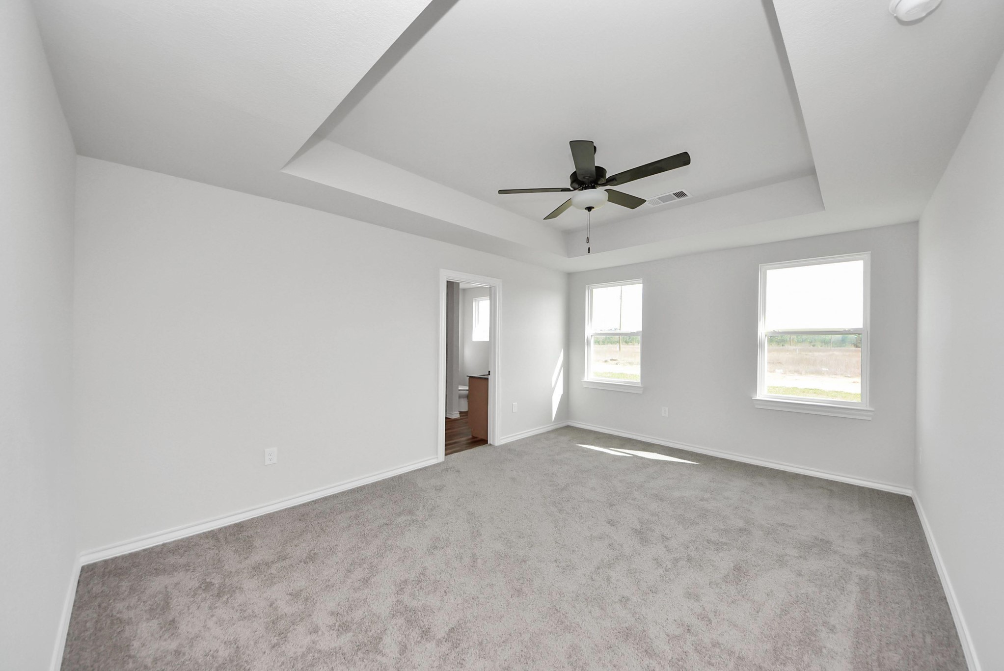 25740 John Wayne Drive Splendora, TX 77372 - Photo 23 of 48 a view of a livingroom with a ceiling fan and window