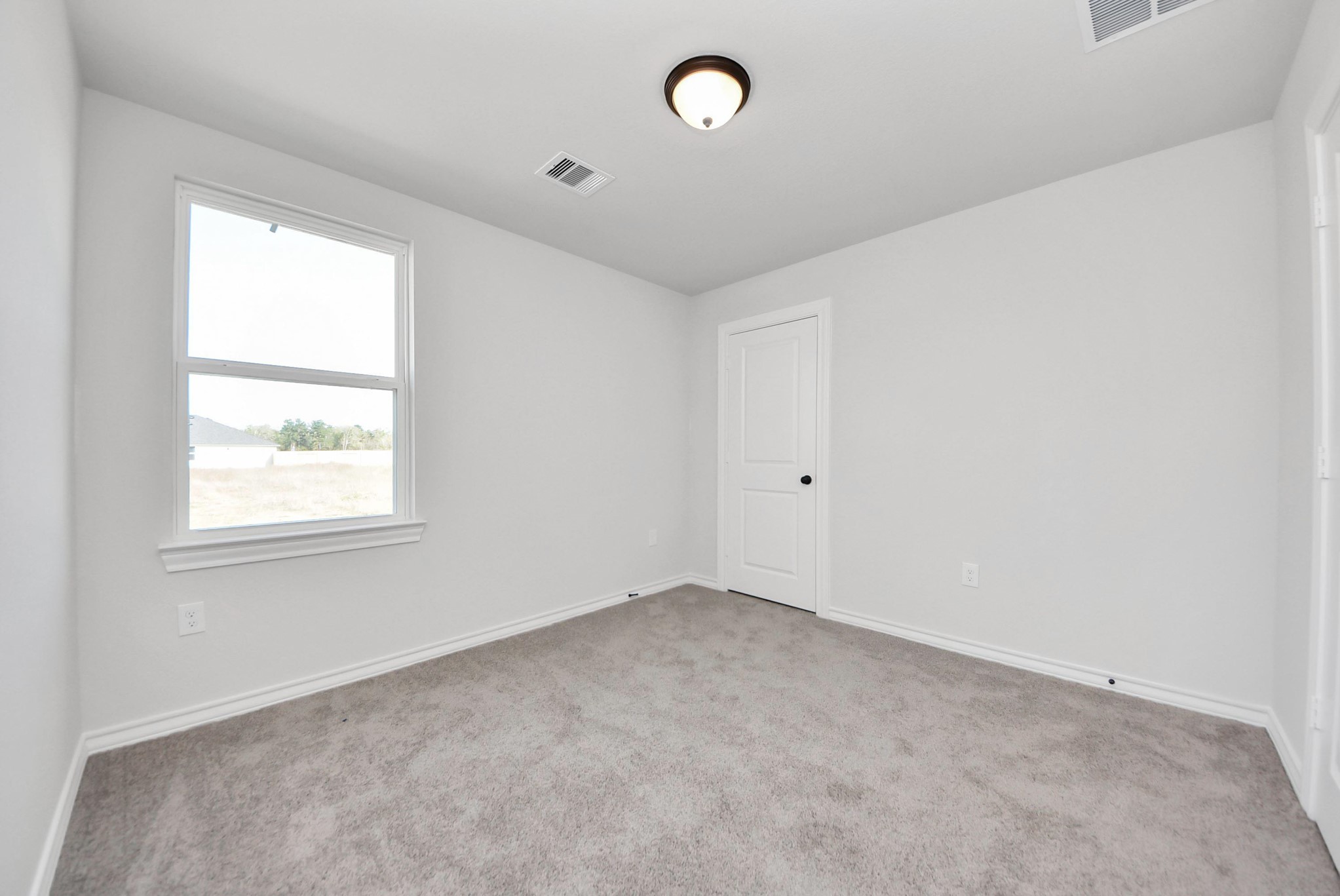 25740 John Wayne Drive Splendora, TX 77372 - Photo 38 of 48 an empty room with a window