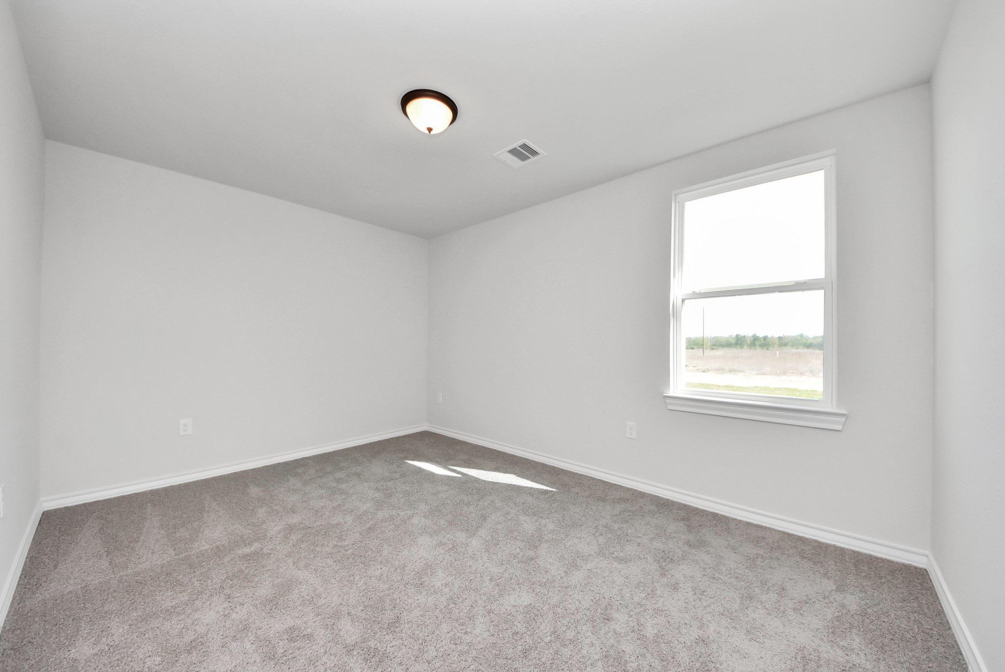 25740 John Wayne Drive Splendora, TX 77372 - Photo 39 of 48 an empty room with a window