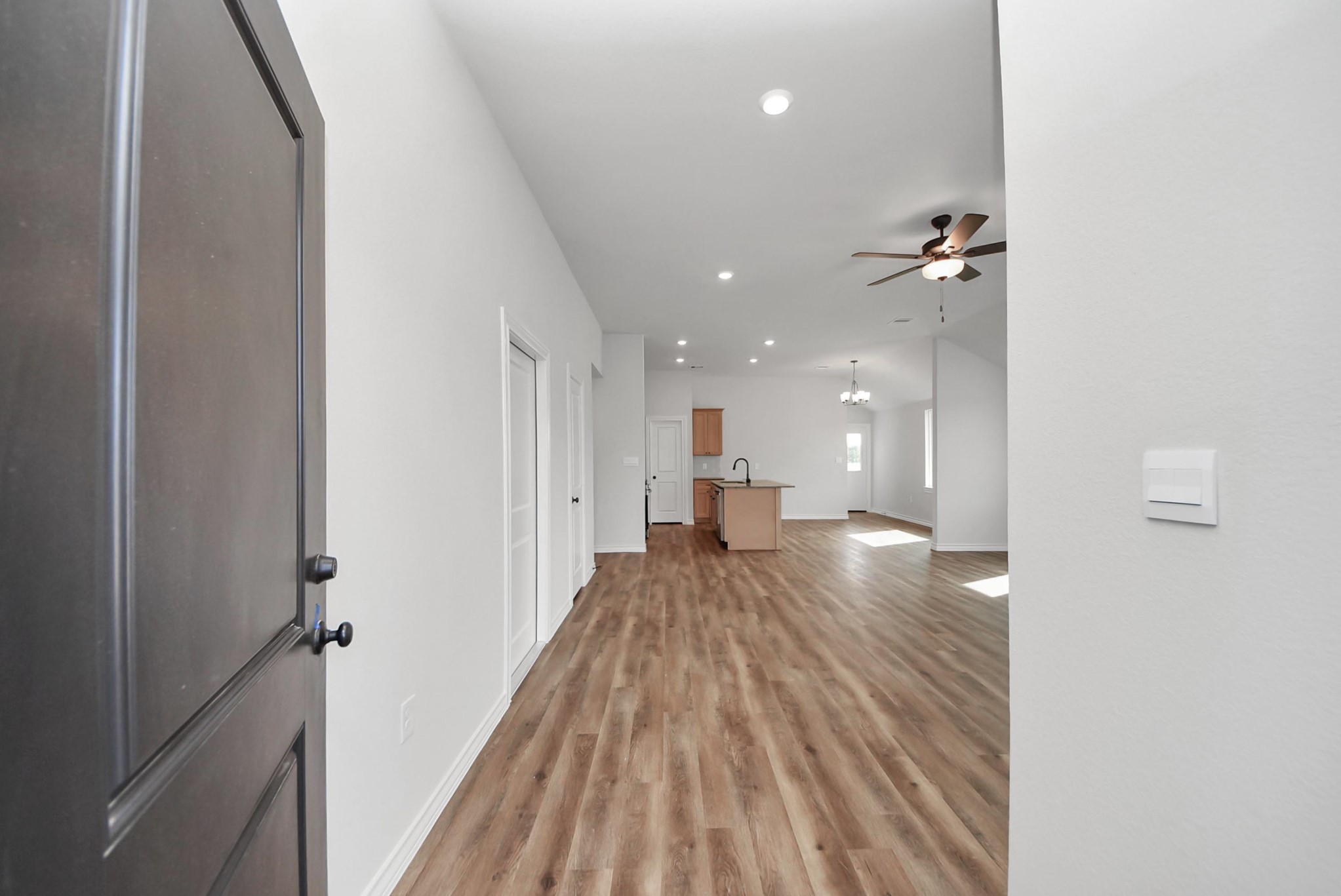 25740 John Wayne Drive Splendora, TX 77372 - Photo 6 of 48 a view of a hallway with wooden floor
