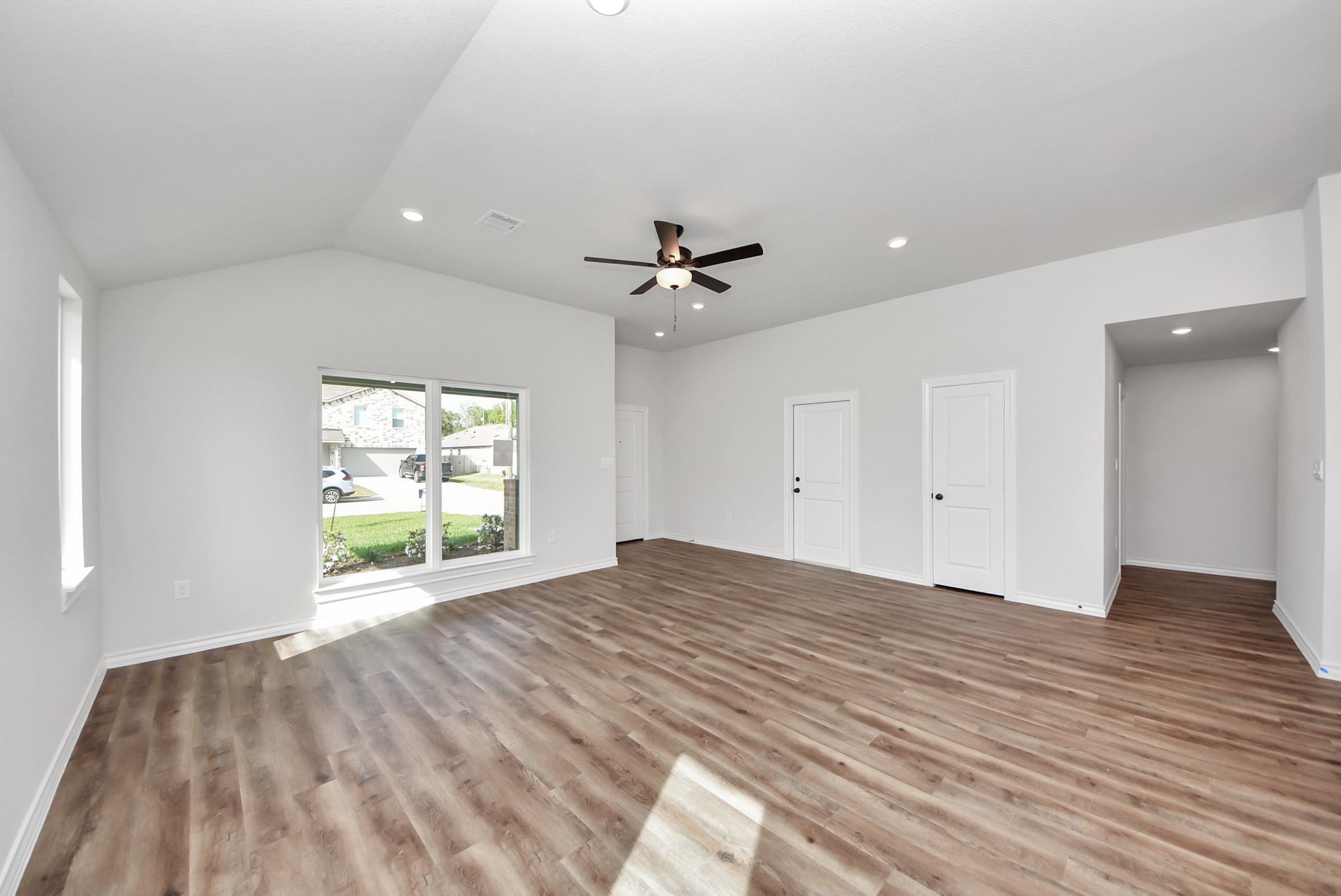 25740 John Wayne Drive Splendora, TX 77372 - Photo 9 of 48 wooden floor in an empty room with a window