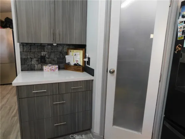 a kitchen with a sink and cabinets