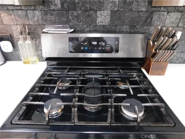 a kitchen with a stove and a microwave