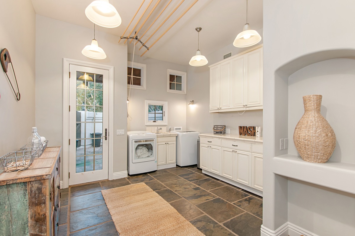 14955 Rancho Santa Fe Farms Road Rancho Santa Fe, CA 92067 - Photo 21 of 25 Generous sized laundry room with exterior access off driveway.