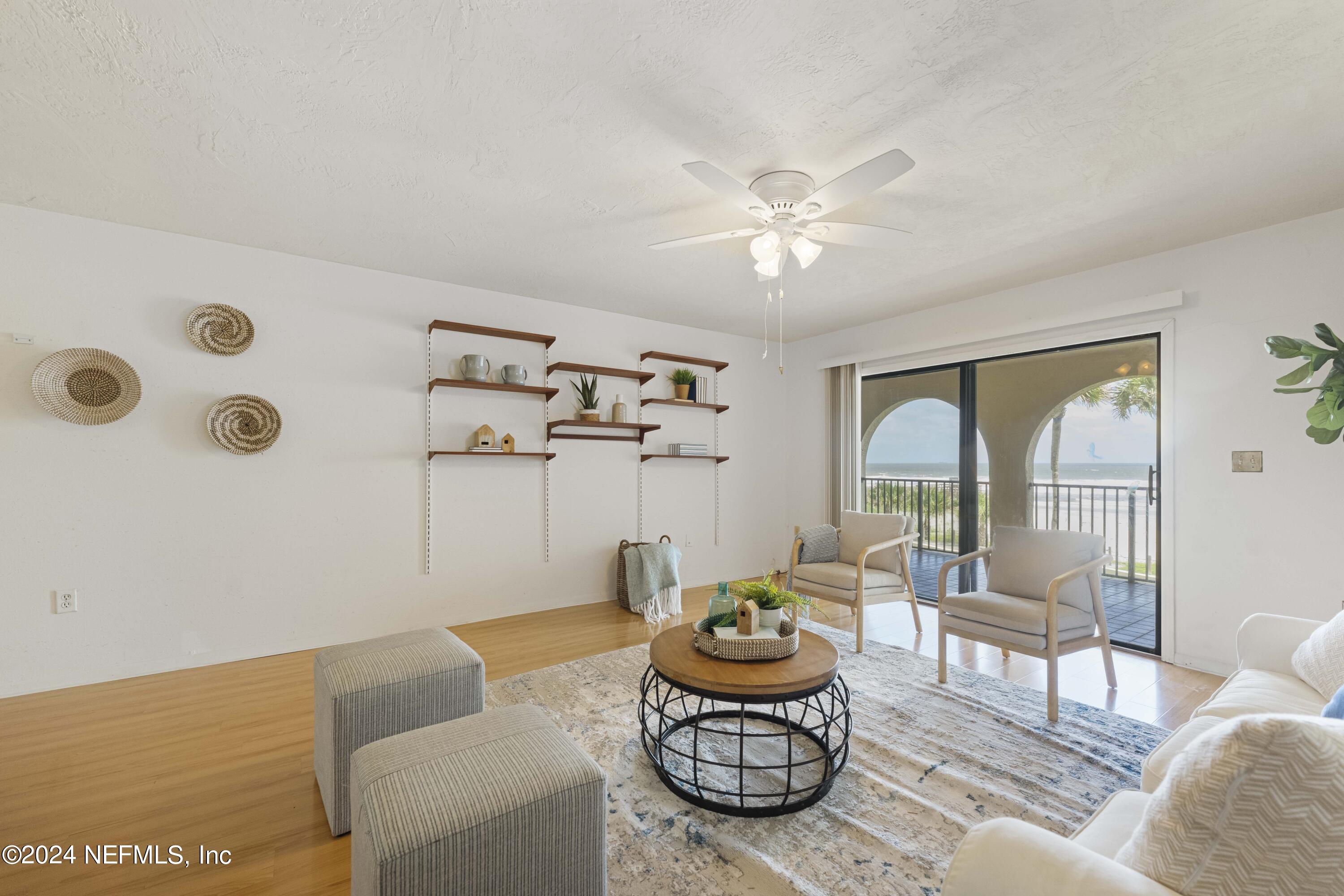 10 10th Street, Unit 17 Atlantic Beach, FL 32233 - Photo 13 of 60 a living room with furniture and a large window