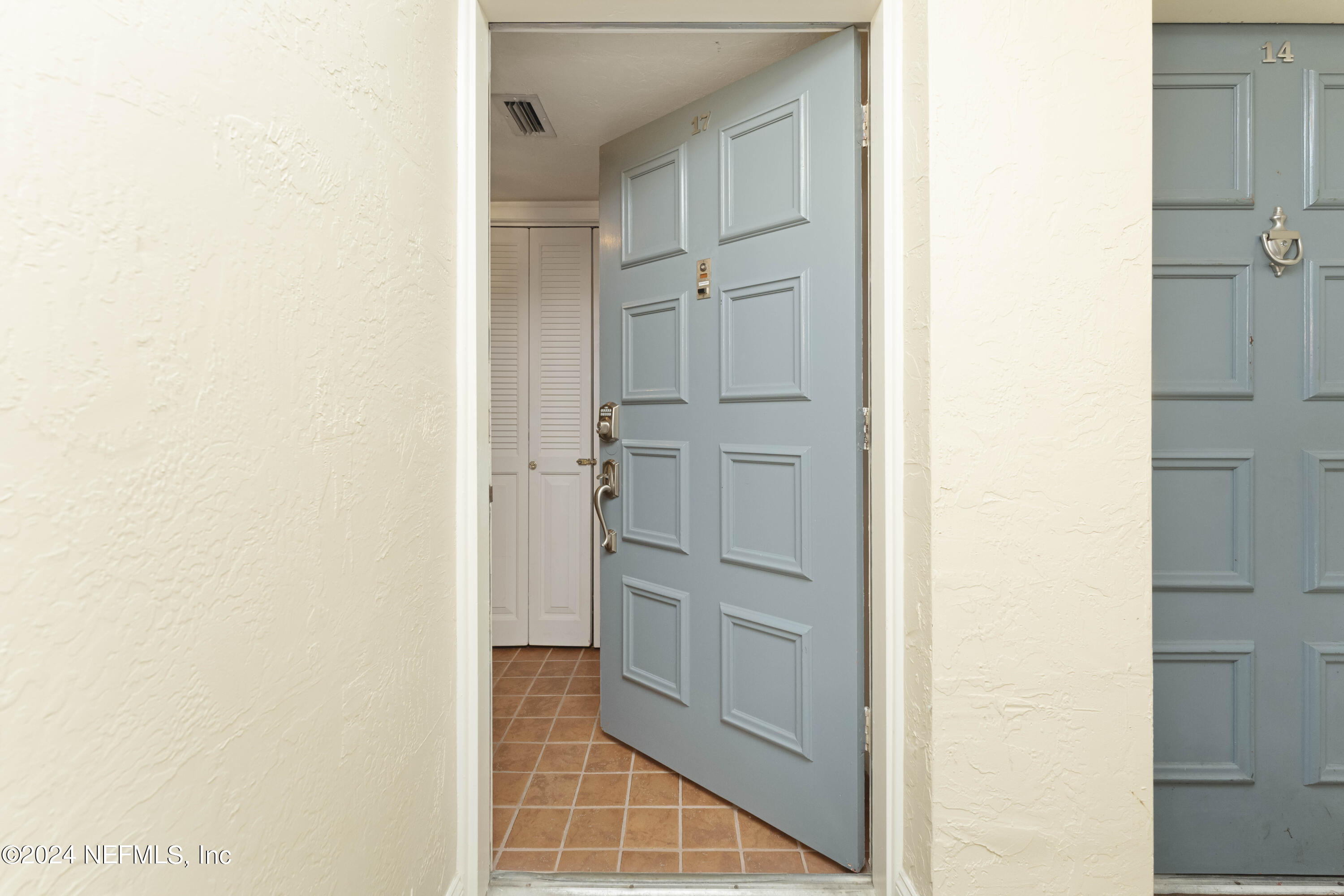 10 10th Street, Unit 17 Atlantic Beach, FL 32233 - Photo 8 of 60 a view of walk in closet with white walls