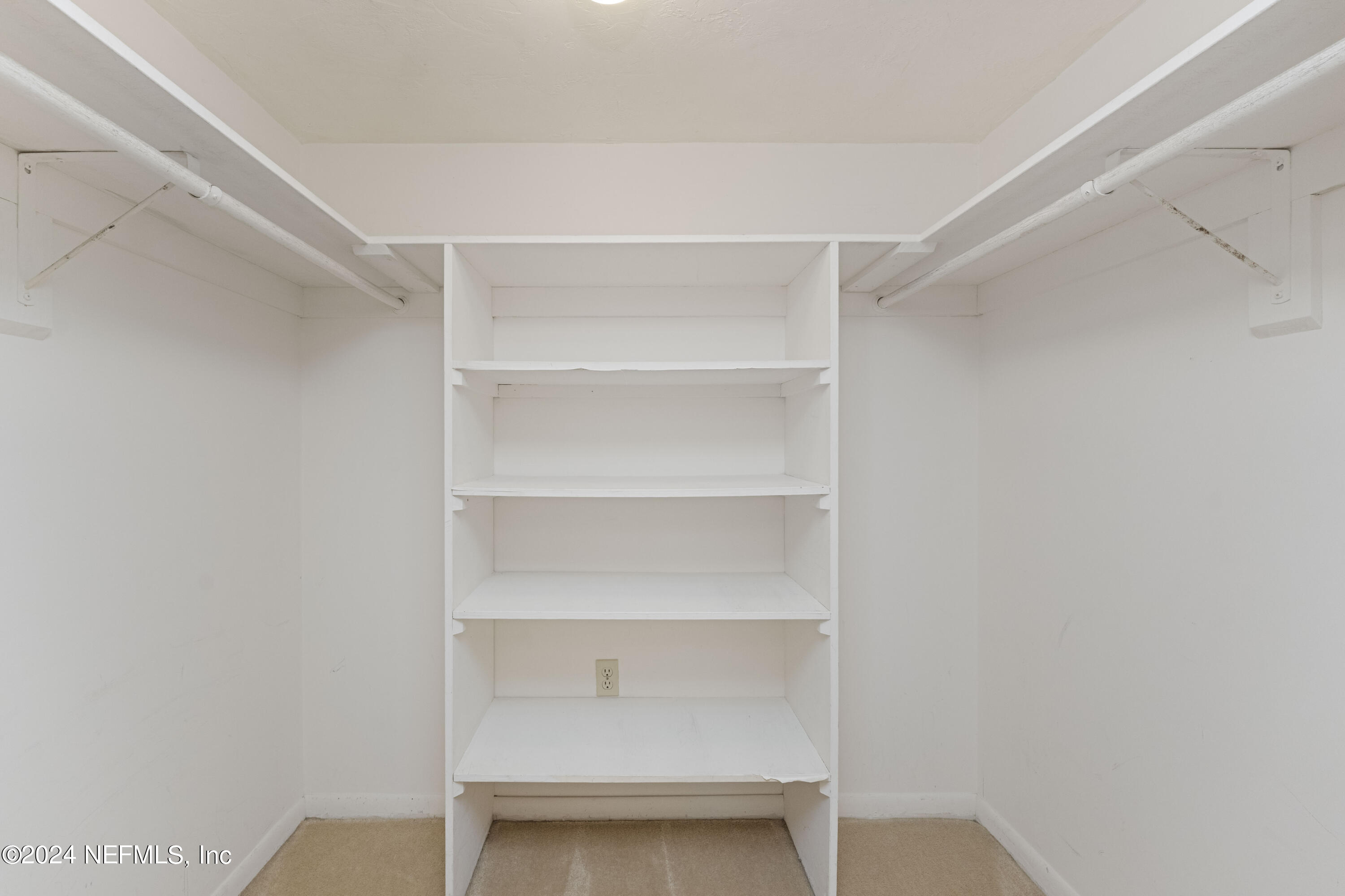 10 10th Street, Unit 17 Atlantic Beach, FL 32233 - Photo 10 of 60 a view of an empty walk in closet