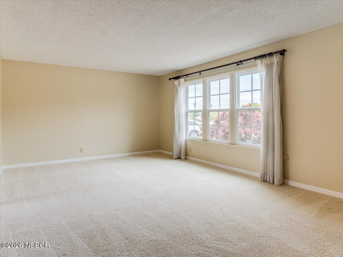 360 Tallyho Road Santa Maria, CA 93455 - Photo 10 of 72 a view of an empty room with a window