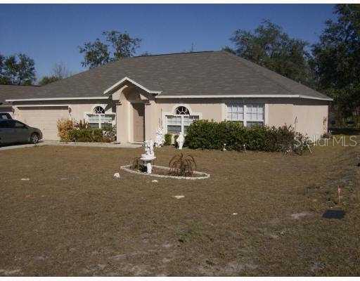 10359 Fordham Street Spring Hill, FL 34608 - Photo 1 of 1 a view of a house with outdoor space