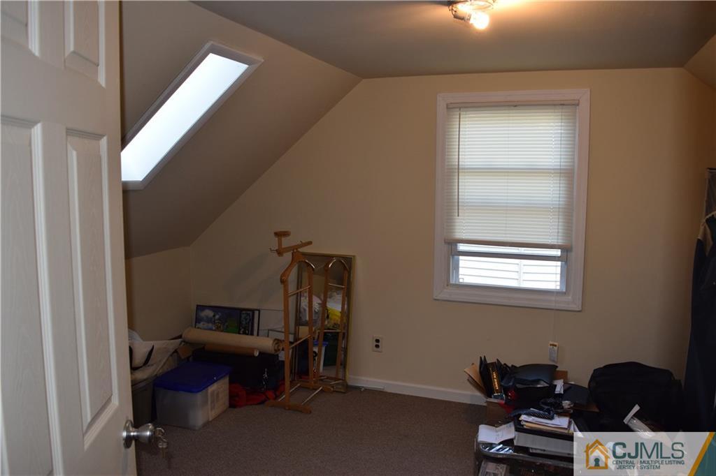 1087 Sayre Road South Union, NJ 07083 - Photo 19 of 20 a room with furniture and musical instruments