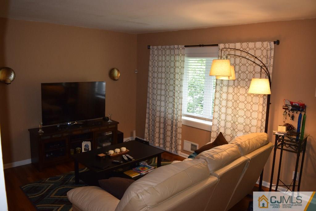 1087 Sayre Road South Union, NJ 07083 - Photo 4 of 20 a living room with furniture and a flat screen tv