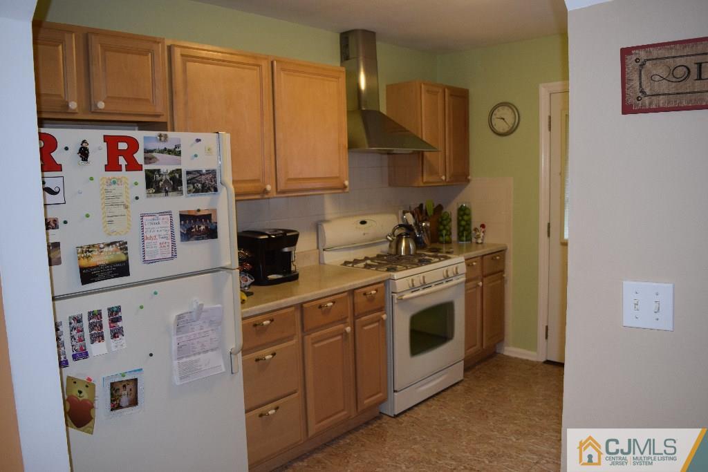1087 Sayre Road South Union, NJ 07083 - Photo 6 of 20 a kitchen with stainless steel appliances granite countertop a sink and cabinets