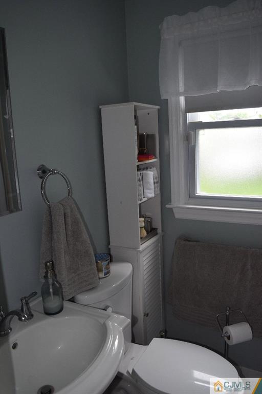 1087 Sayre Road South Union, NJ 07083 - Photo 9 of 20 a bathroom with a sink and a toilet