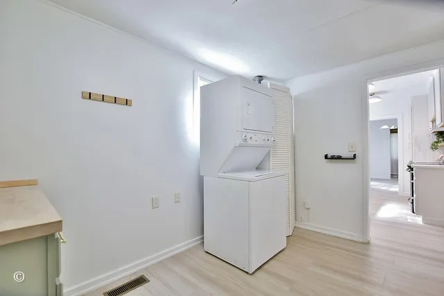 a view of hallway with wooden floor