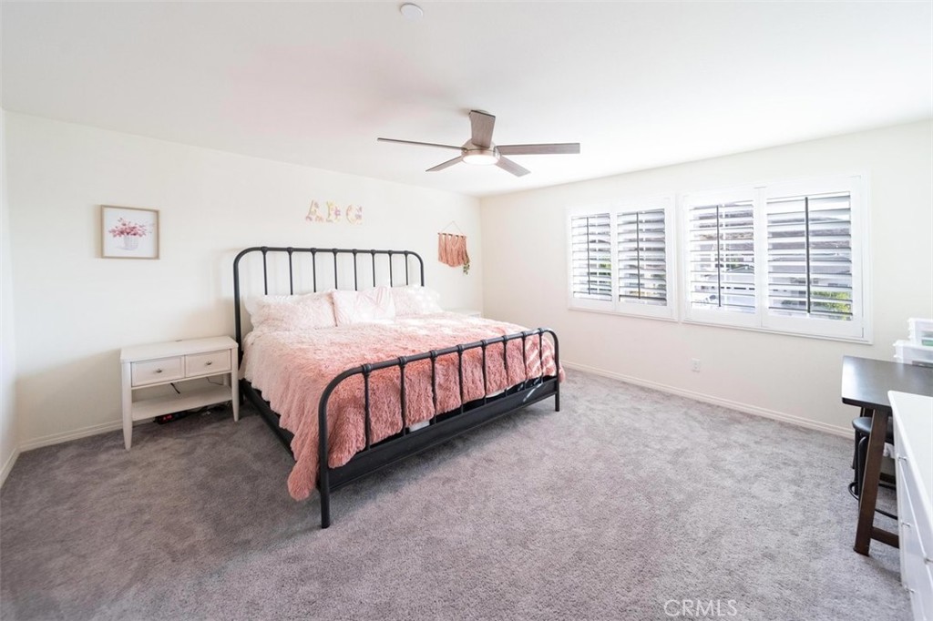 32078 Rambling Court Winchester, CA 92596 - Photo 31 of 48 a bedroom with a bed and a table in it