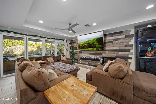 a bedroom with furniture and a fireplace