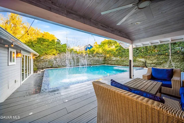 a kitchen with a table chairs a sink dishwasher window and cabinets