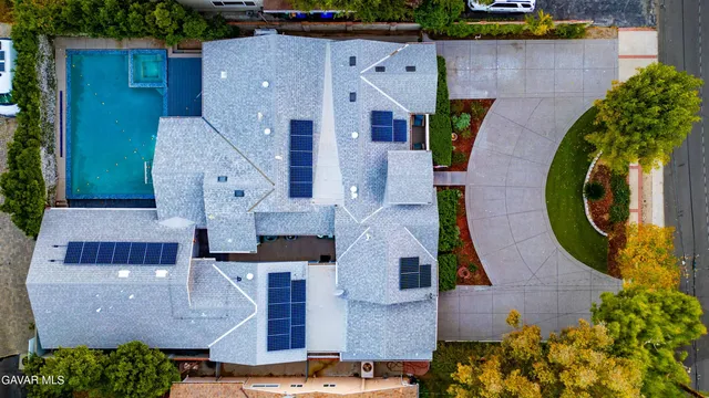 an aerial view of houses with outdoor space