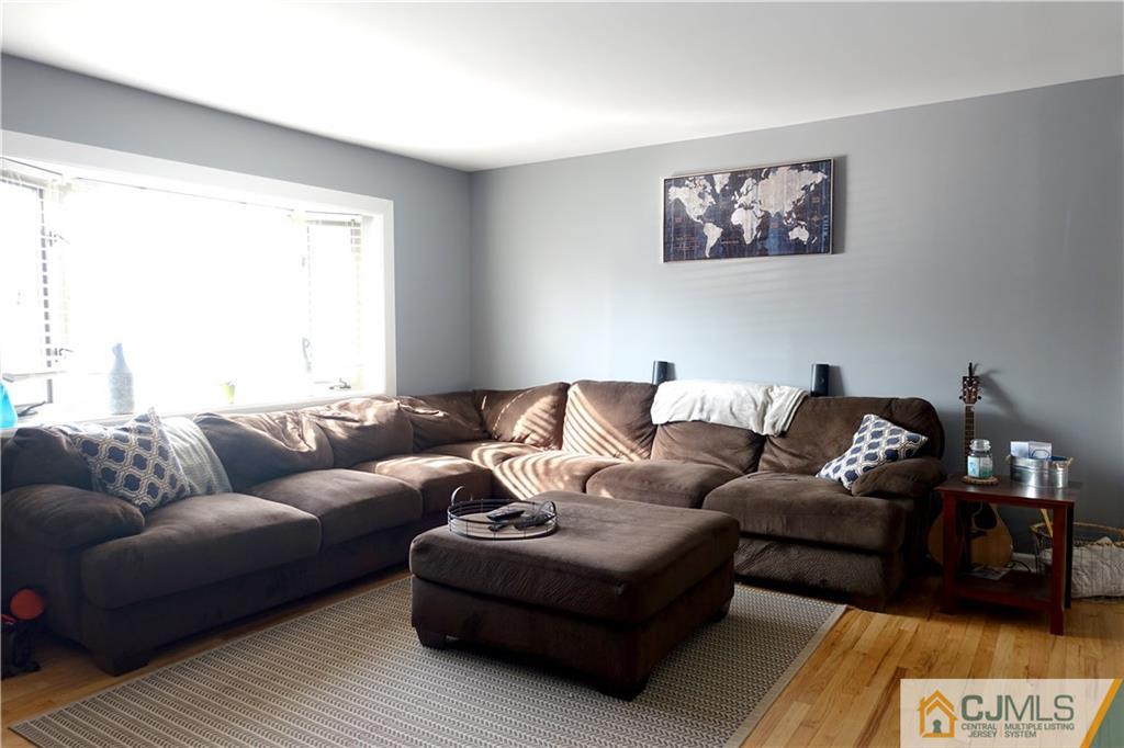 194 McFarlane Road Colonia, NJ 07067 - Photo 2 of 16 a living room with furniture and a couch