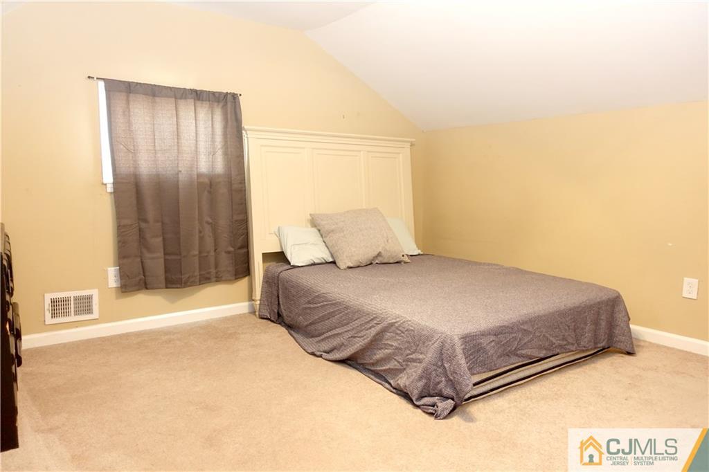 194 McFarlane Road Colonia, NJ 07067 - Photo 15 of 16 a bedroom with a bed and a window