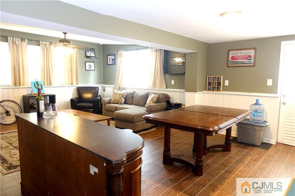 194 McFarlane Road Colonia, NJ 07067 - Photo 8 of 16 a living room with fireplace furniture and a table