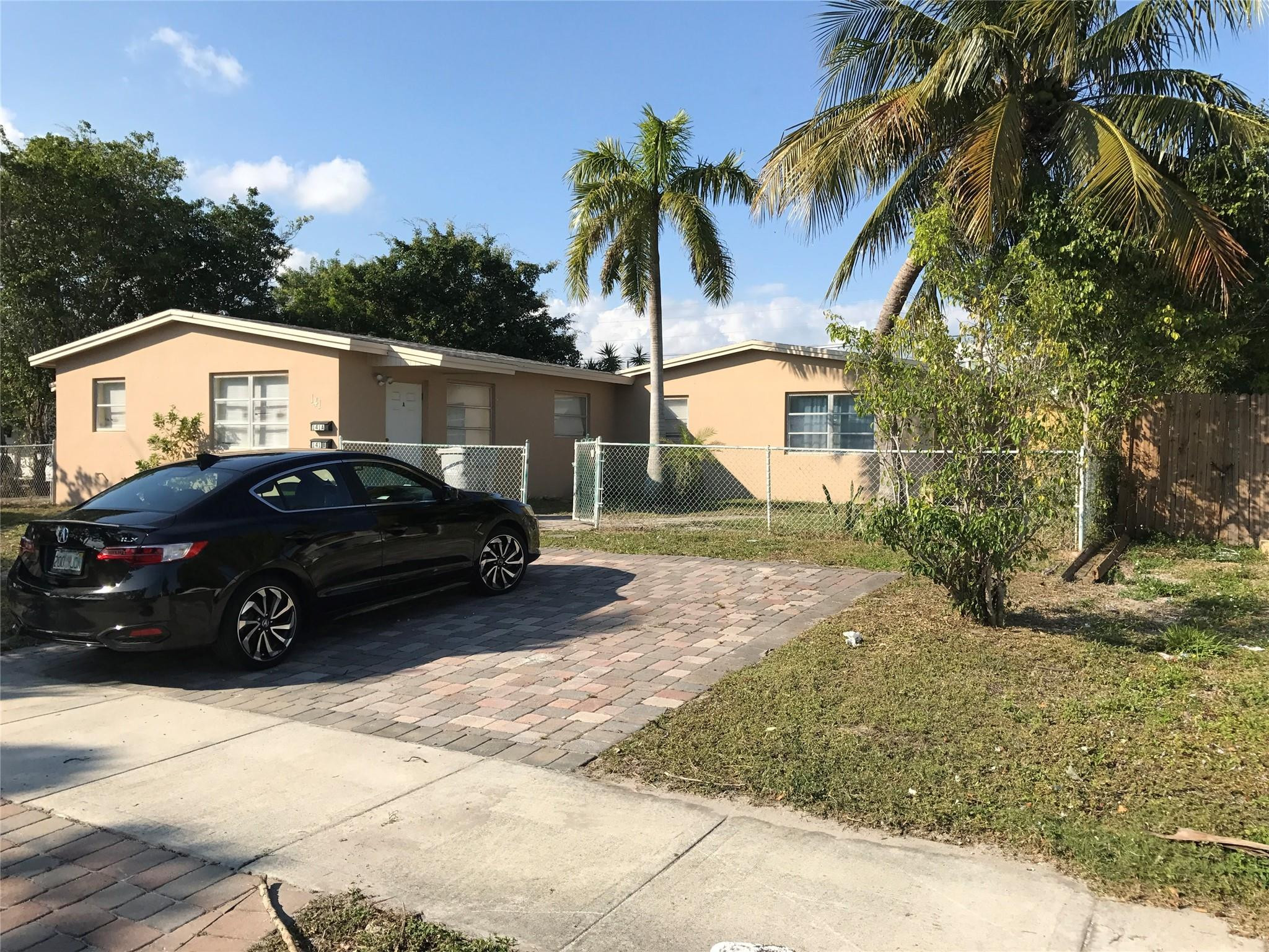 Undisclosed Address Pompano Beach, FL 33064 - Photo 4 of 5 a view of a car parked front of a house