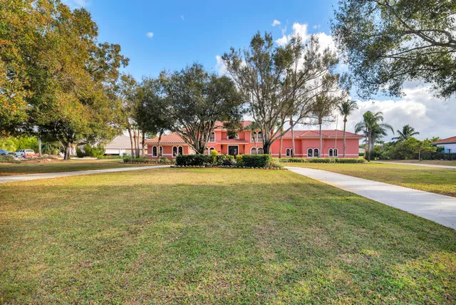 a view of outdoor space with garden and trees