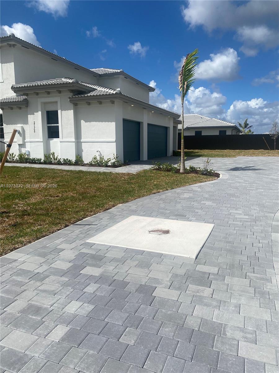 27559 Southwest 159th Place Homestead, FL 33033 - Photo 13 of 14 a view of a house with swimming pool and a yard
