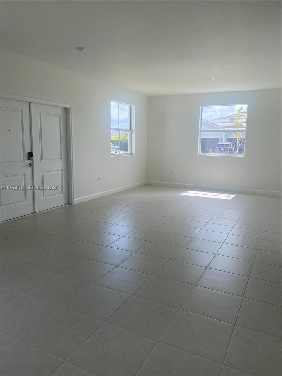 27559 Southwest 159th Place Homestead, FL 33033 - Photo 5 of 14 a view of an empty room with a window