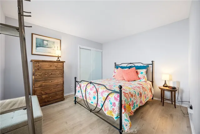a bathroom with a toilet sink vanity granite and shower