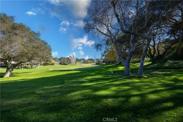 a view of a house with a swimming pool and a table and chairs
