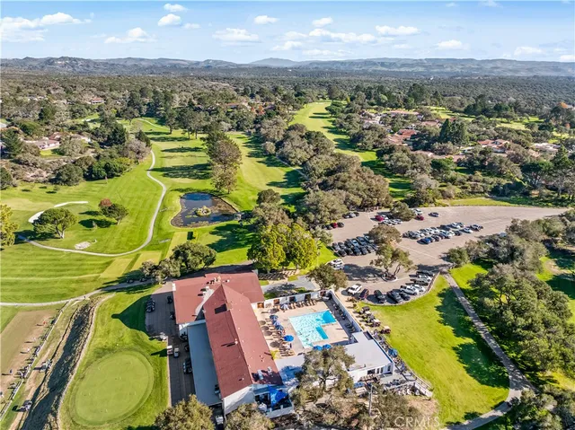 a view of a swimming pool with a table and chairs