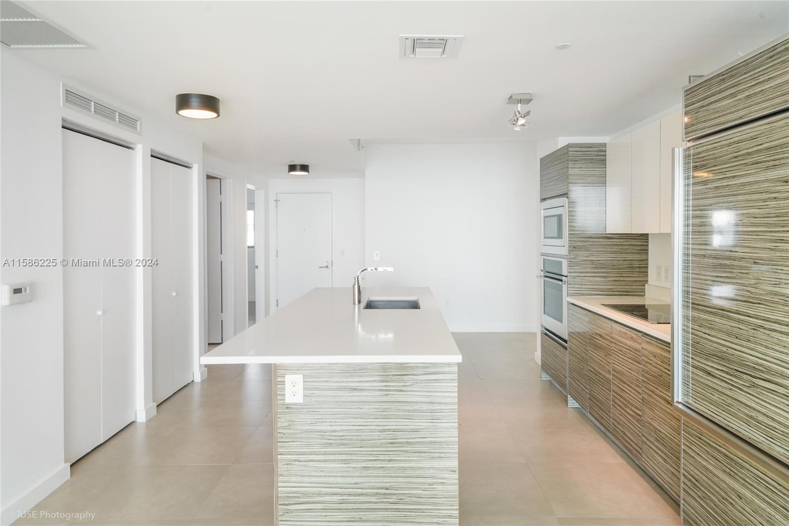 460 Northeast 28th Street, Unit 806 Miami, FL 33137 - Photo 14 of 19 a bathroom with a sink a shower and a mirror