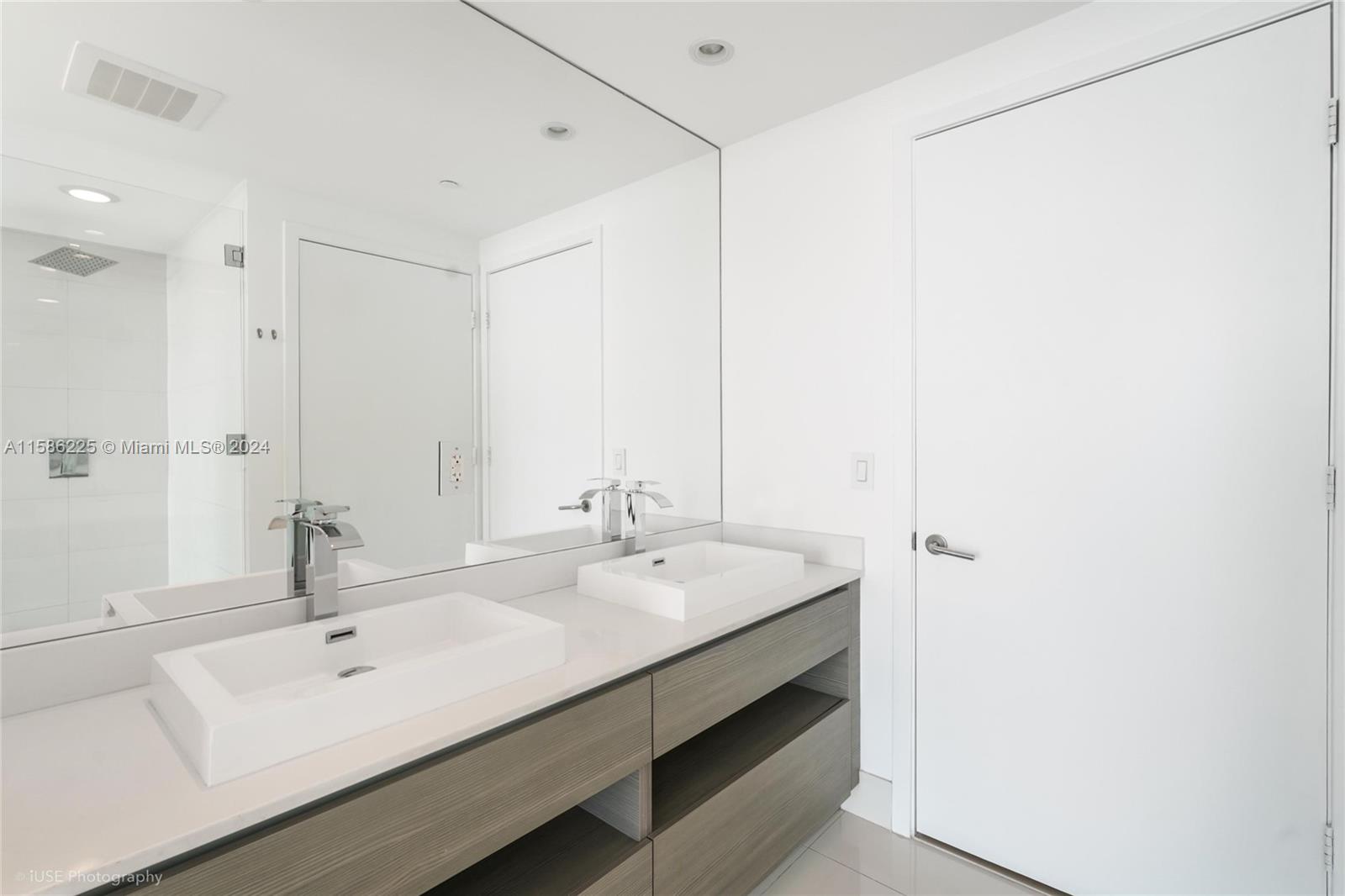 460 Northeast 28th Street, Unit 806 Miami, FL 33137 - Photo 7 of 19 a bathroom with a sink and a mirror