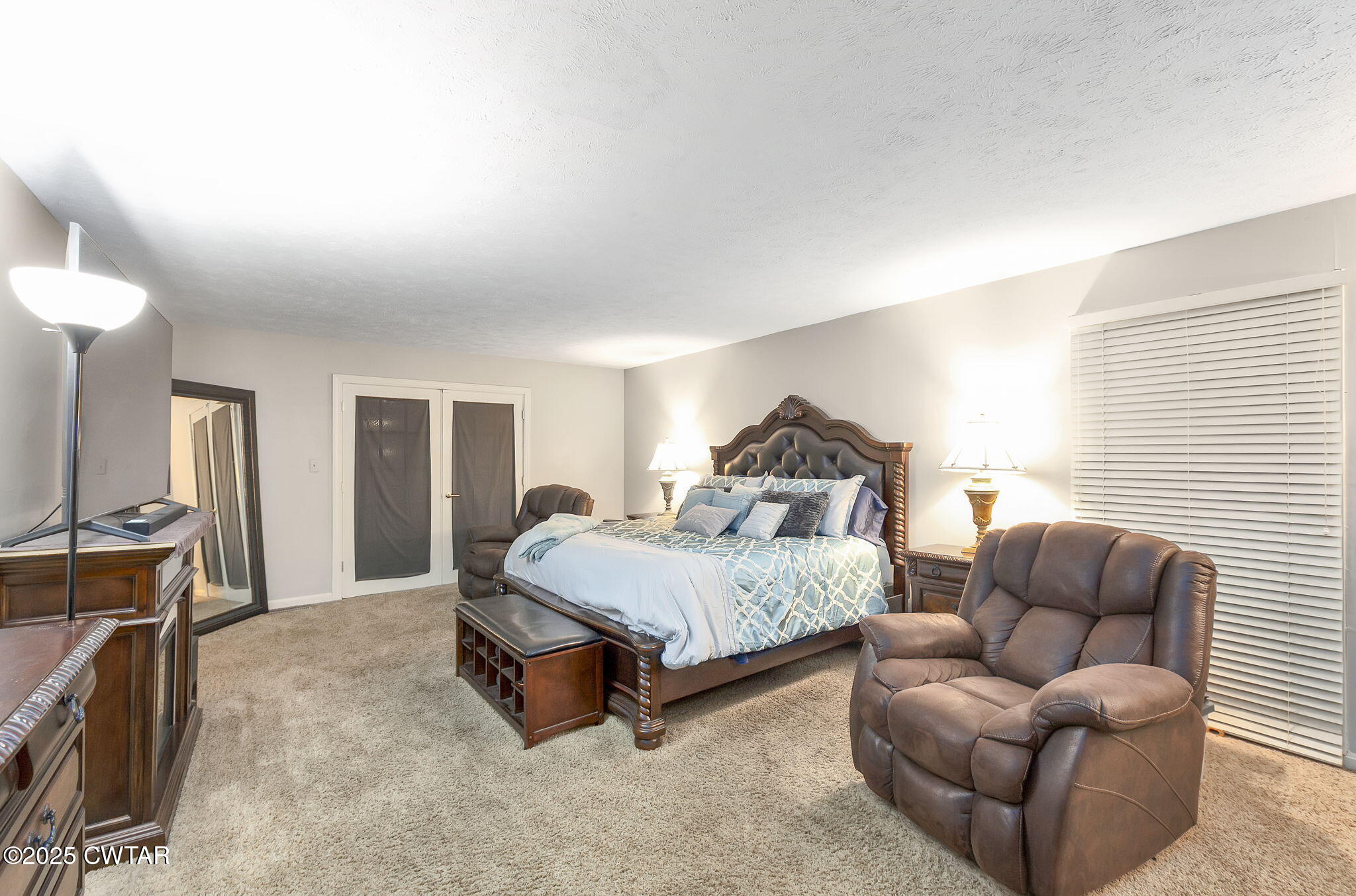 117 Tuckahoe Road Jackson, TN 38305 - Photo 19 of 57 a spacious bedroom with a bed couch and window