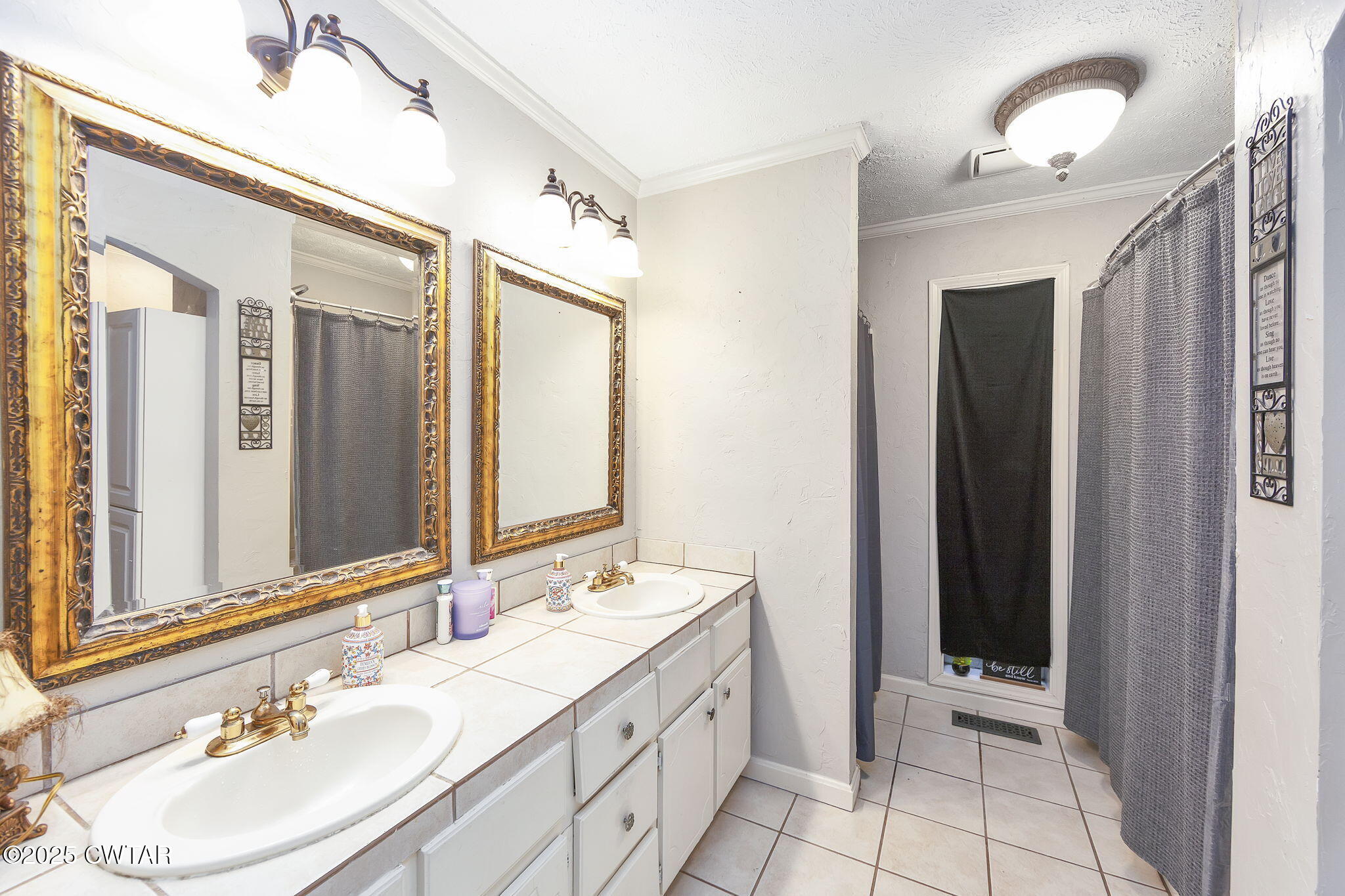 117 Tuckahoe Road Jackson, TN 38305 - Photo 21 of 57 a bathroom with a double vanity sink and a mirror