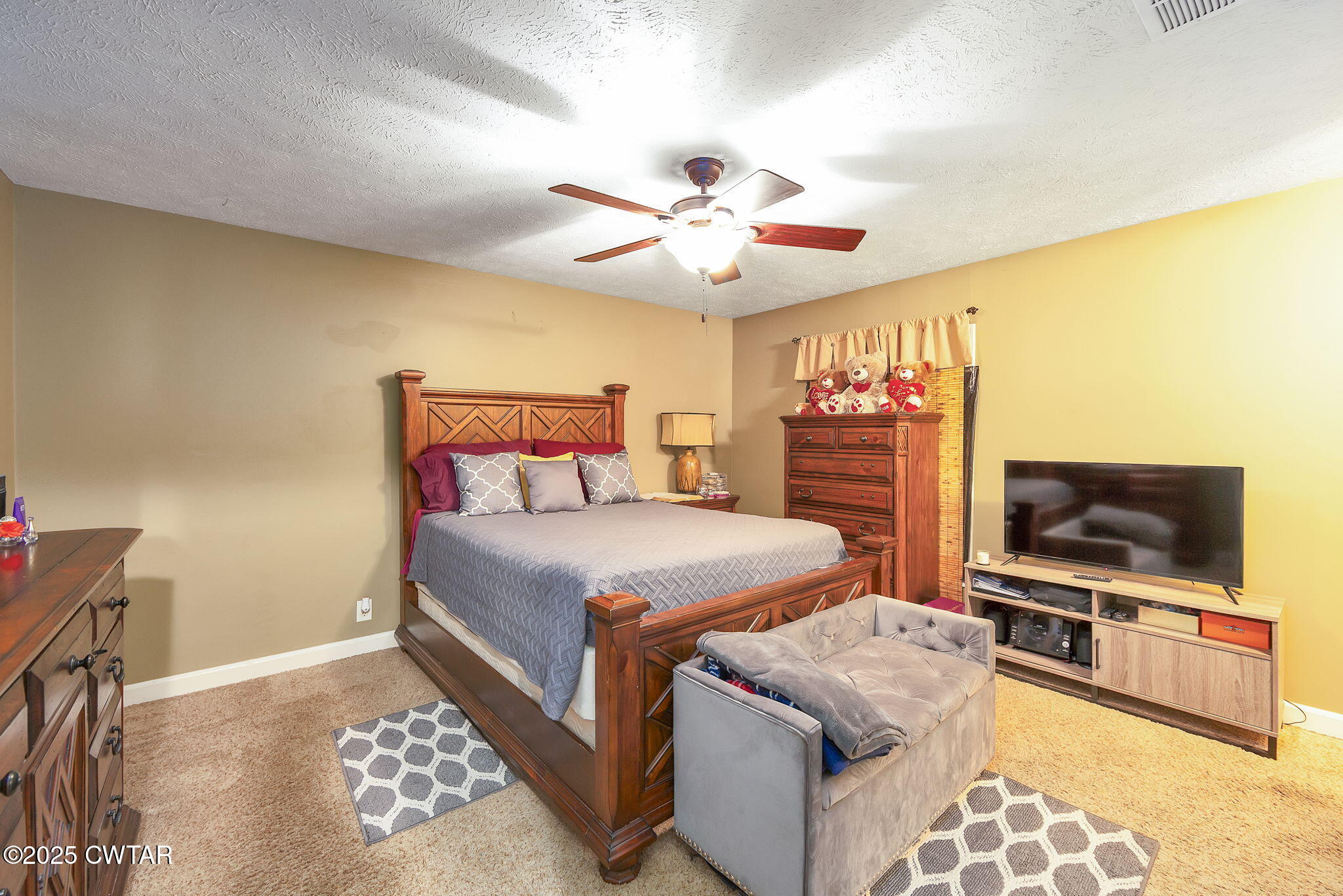 117 Tuckahoe Road Jackson, TN 38305 - Photo 24 of 57 a bedroom with a bed and a flat screen tv