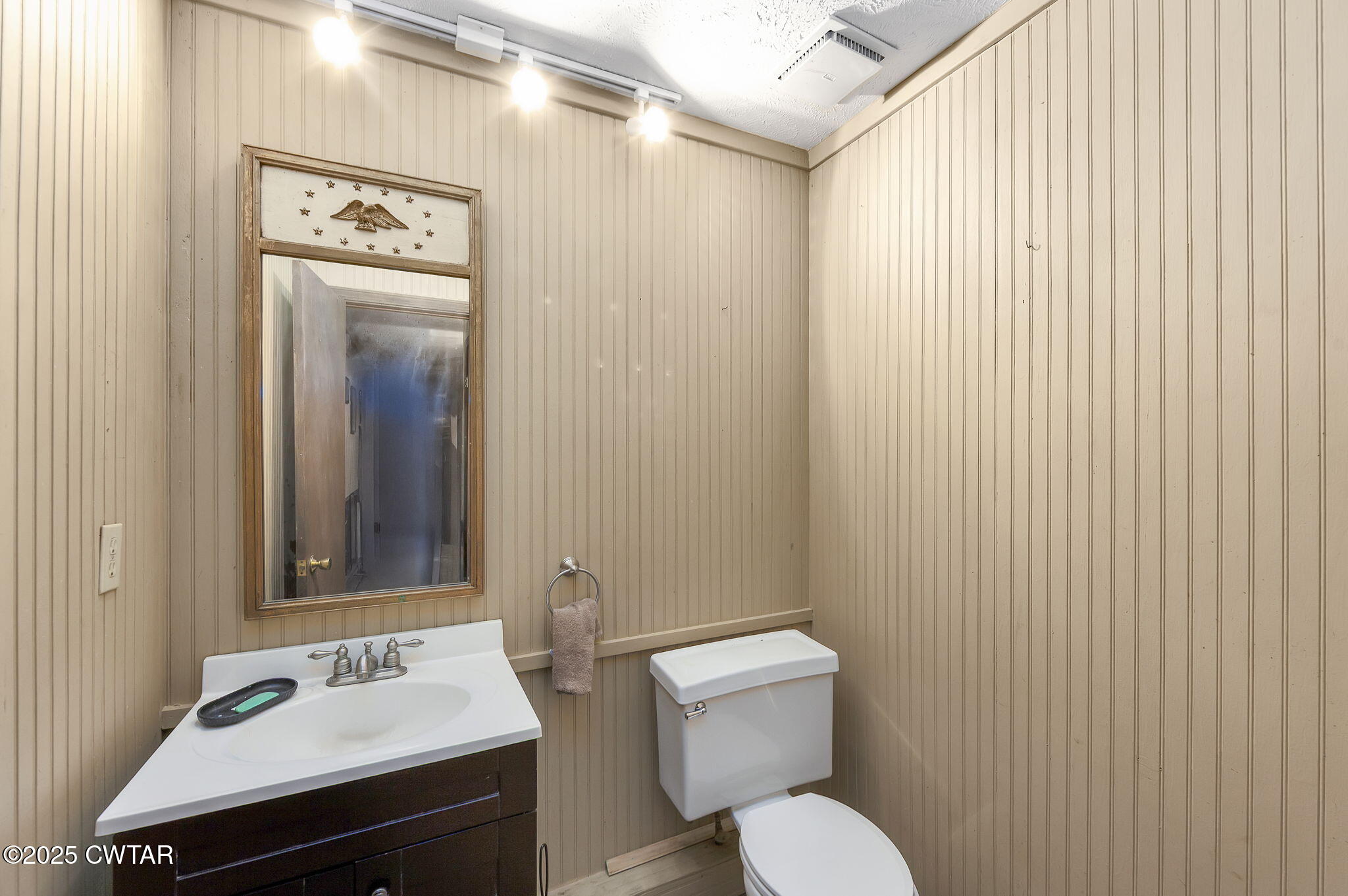 117 Tuckahoe Road Jackson, TN 38305 - Photo 34 of 57 a bathroom with a sink mirror and toilet