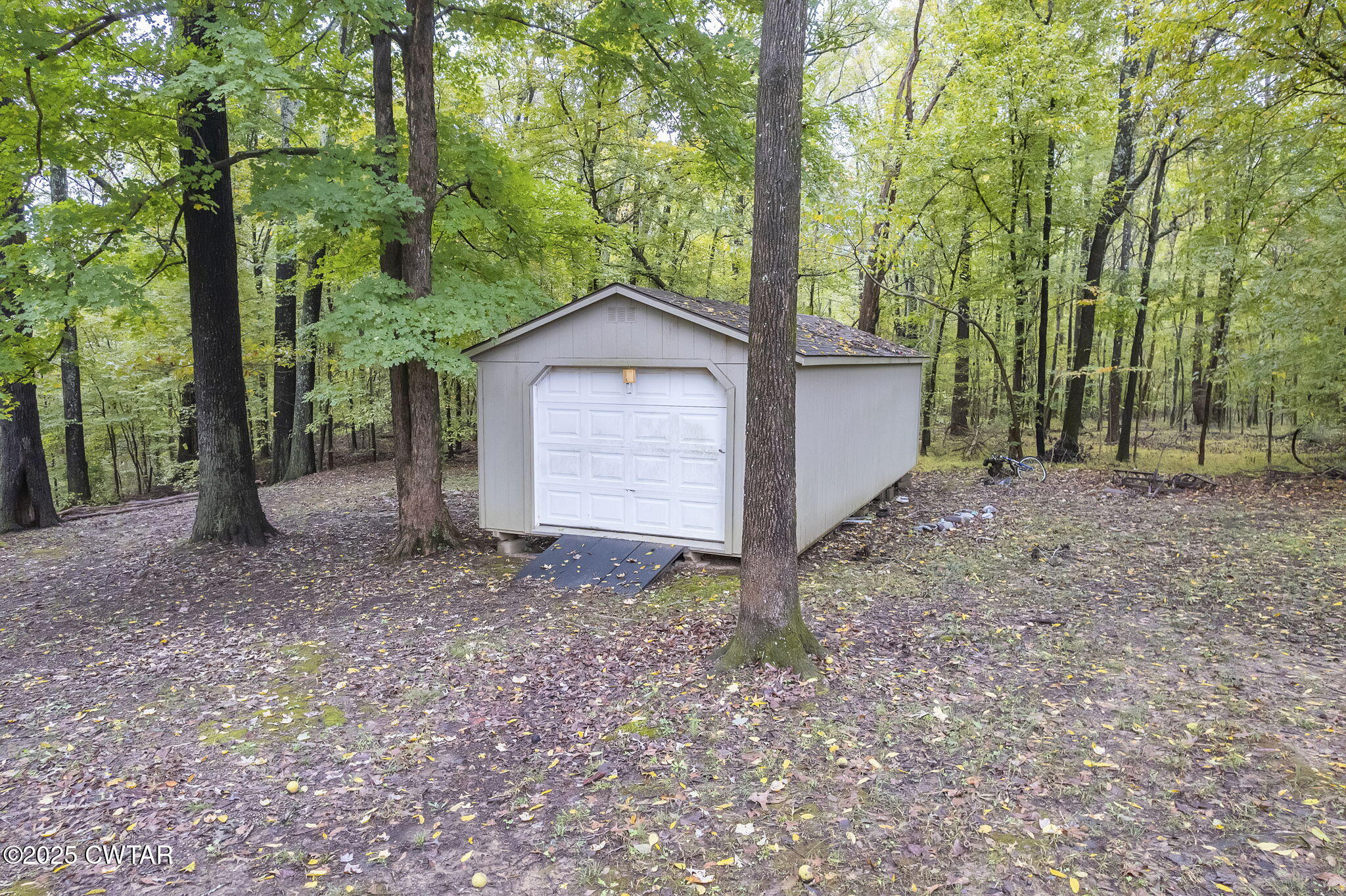117 Tuckahoe Road Jackson, TN 38305 - Photo 49 of 57 a view of a house with a yard and large trees
