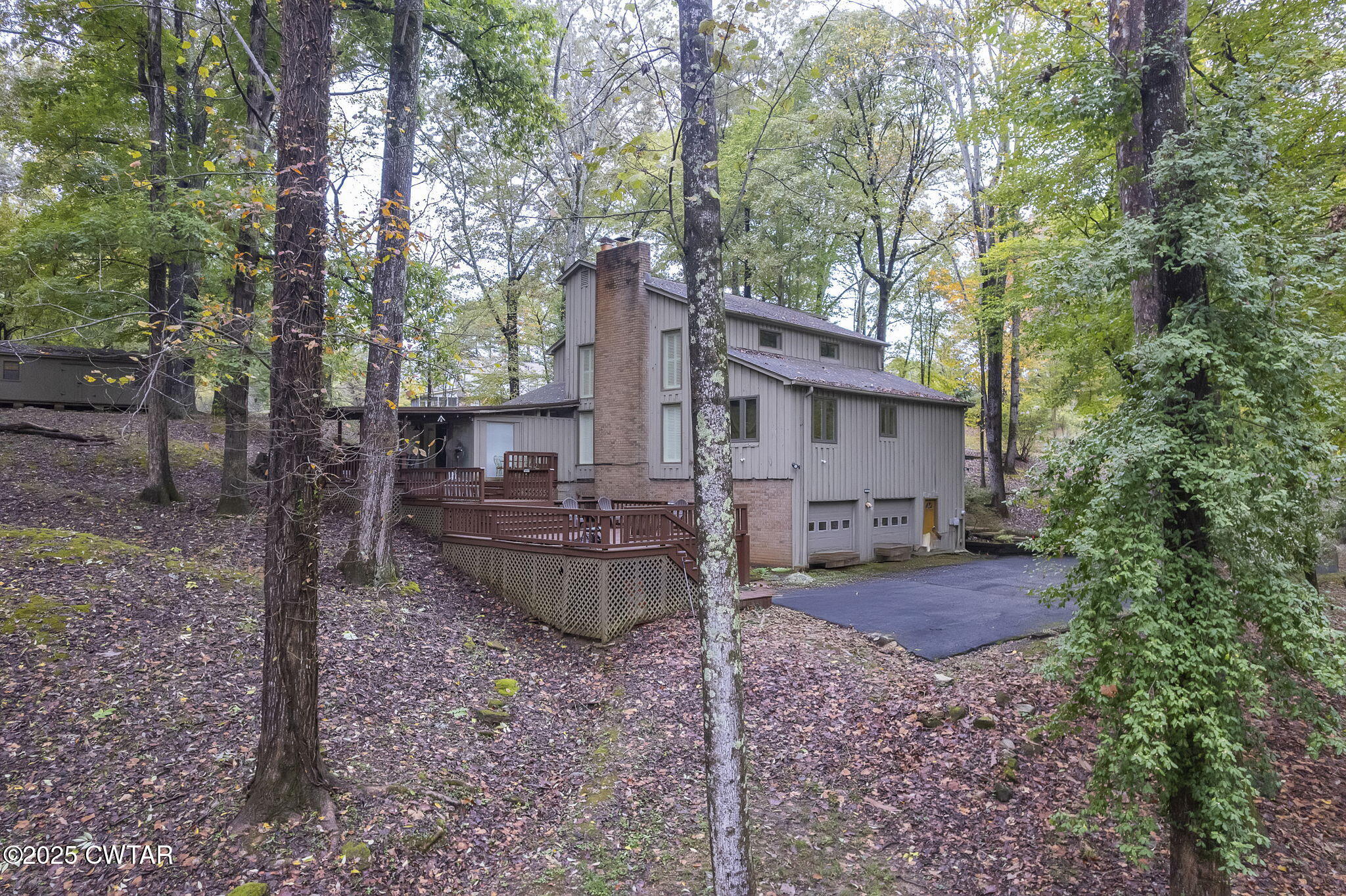 117 Tuckahoe Road Jackson, TN 38305 - Photo 55 of 57 a backyard of a house with barbeque oven table and chairs