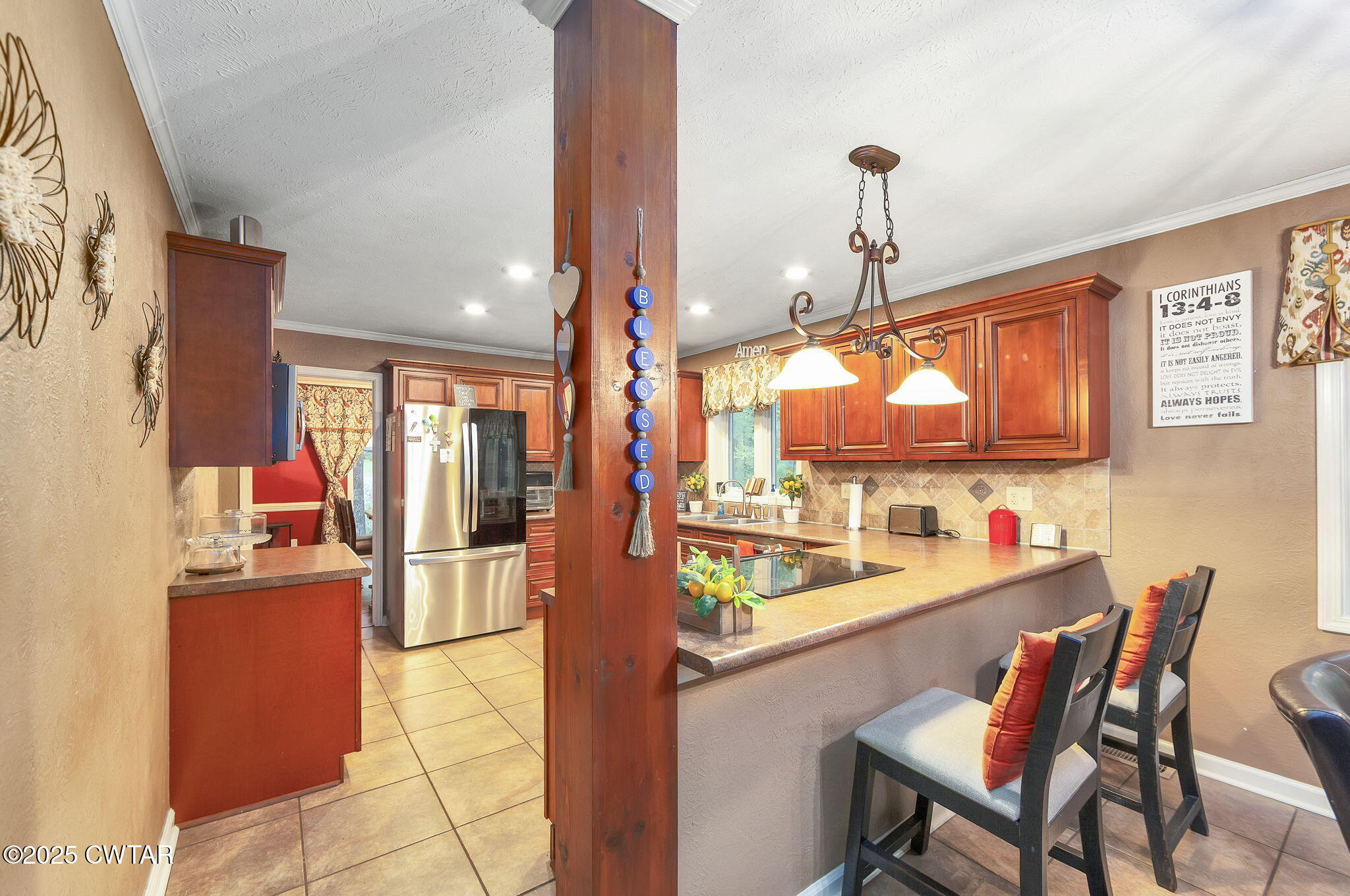 117 Tuckahoe Road Jackson, TN 38305 - Photo 10 of 57 a dining room with furniture and a chandelier