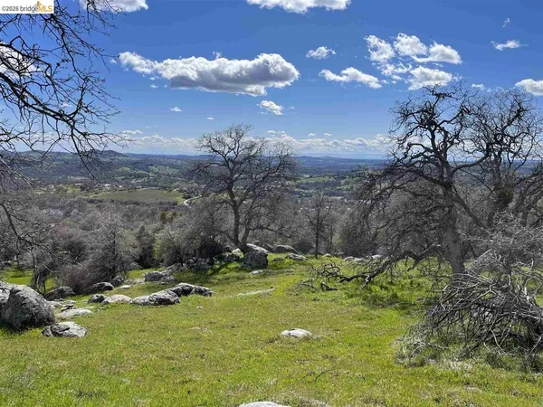 a view of a town with mountains in the background