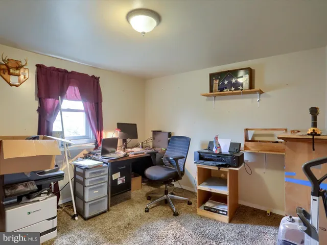 a view of a workspace with furniture