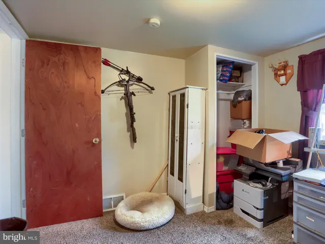 a room with furniture and wooden floor