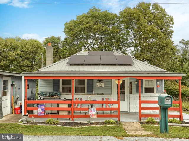 a front view of house with yard and entertaining space