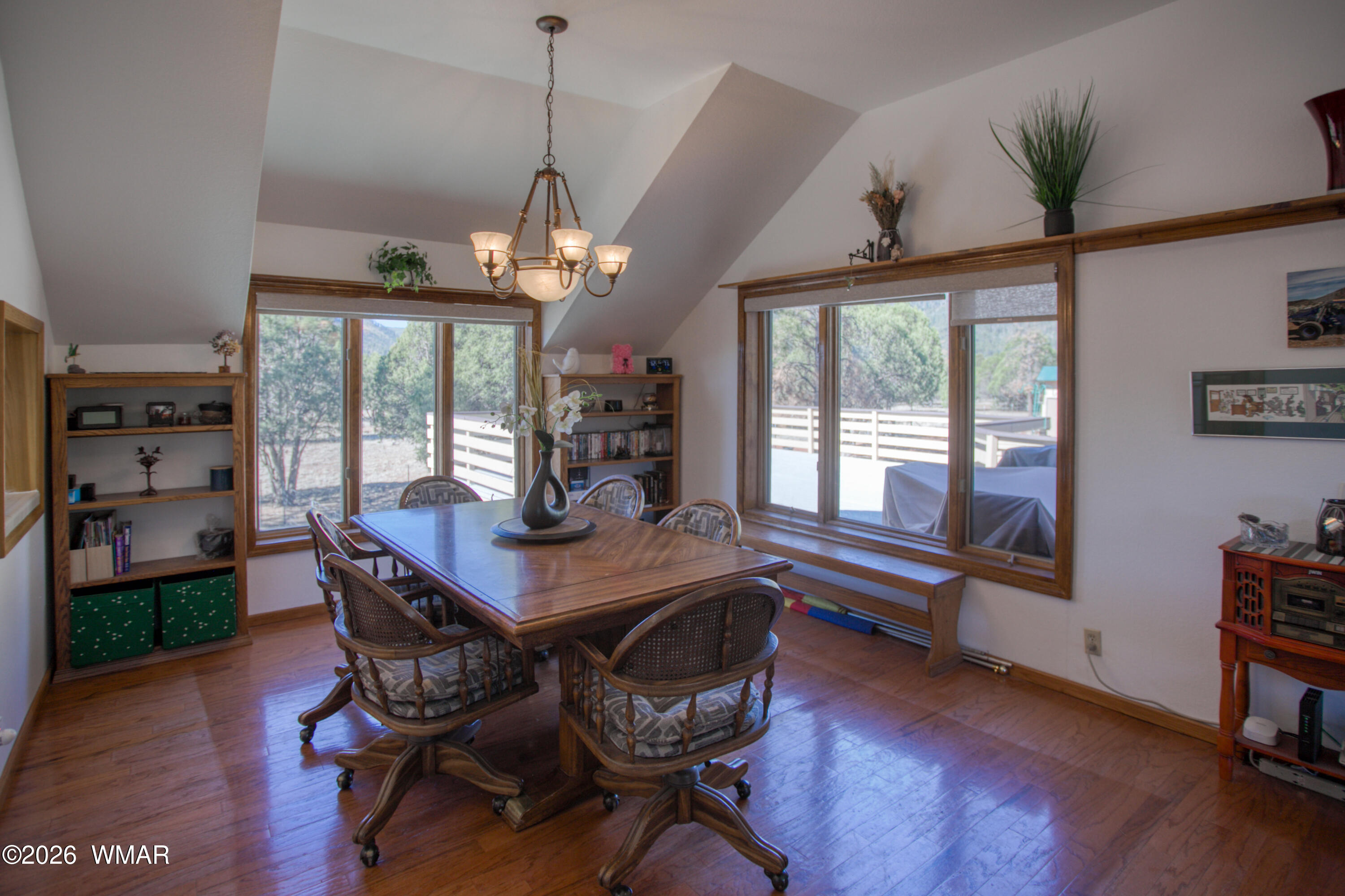 19 County Road Show Low, AZ 85901 - Photo 8 of 43 a view of a dining room with furniture window and wooden floor