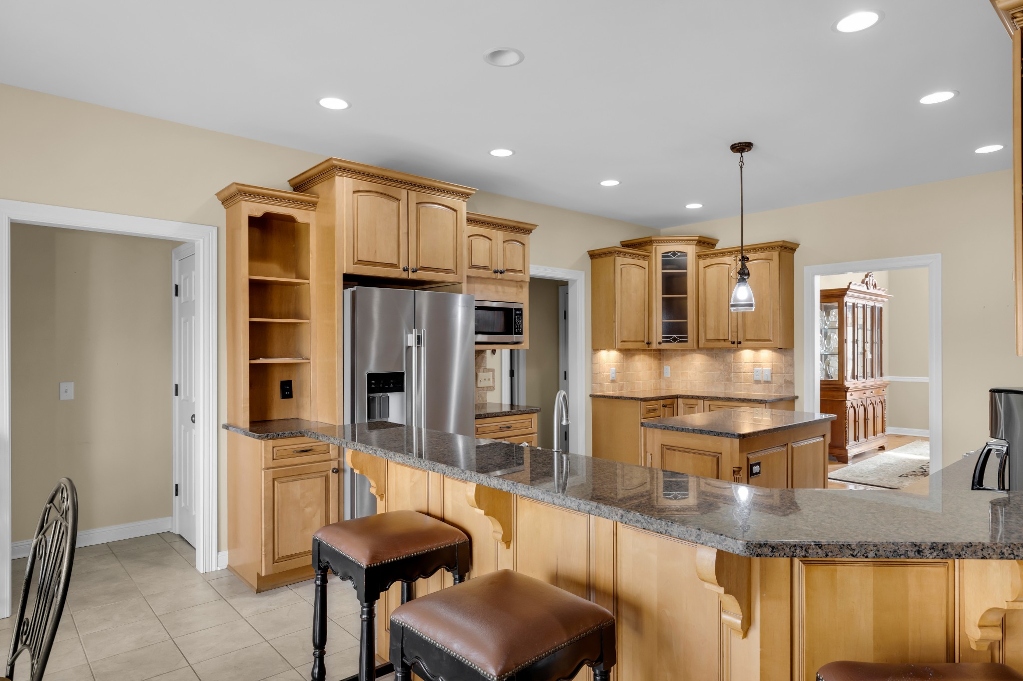 5144 Drake Road Cedar Hill, TN 37032 - Photo 12 of 80 a kitchen with refrigerator and chairs