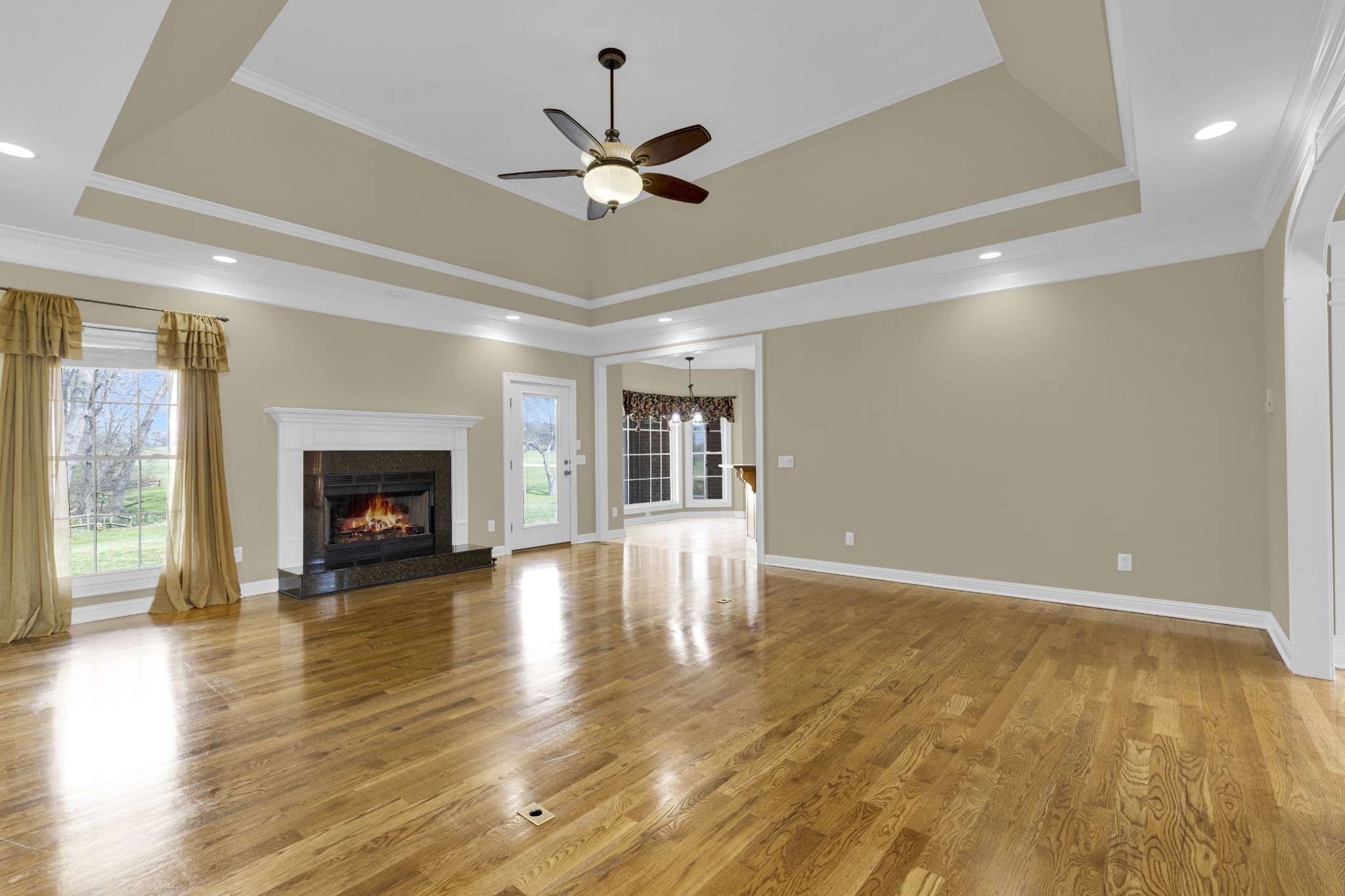 5144 Drake Road Cedar Hill, TN 37032 - Photo 42 of 80 a view of an empty room with wooden floor fireplace and a window